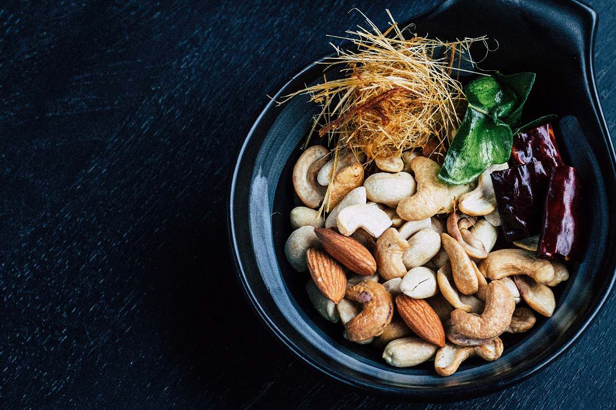 japan village assorted-color nut on vase closeup photo t.suthep